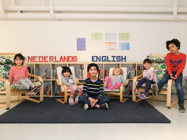 Student with a teacher in a classroom